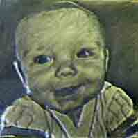 Bronze picture of a baby smiling